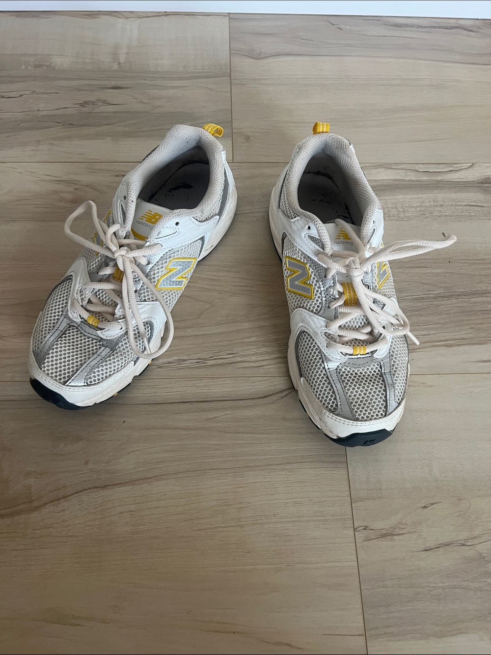 New Balance Women’s White Sneakers with Yellow Accents